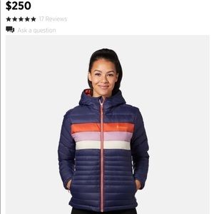 Cotopaxi woman’s jacket. Navy blue with red blue and white stripes.
